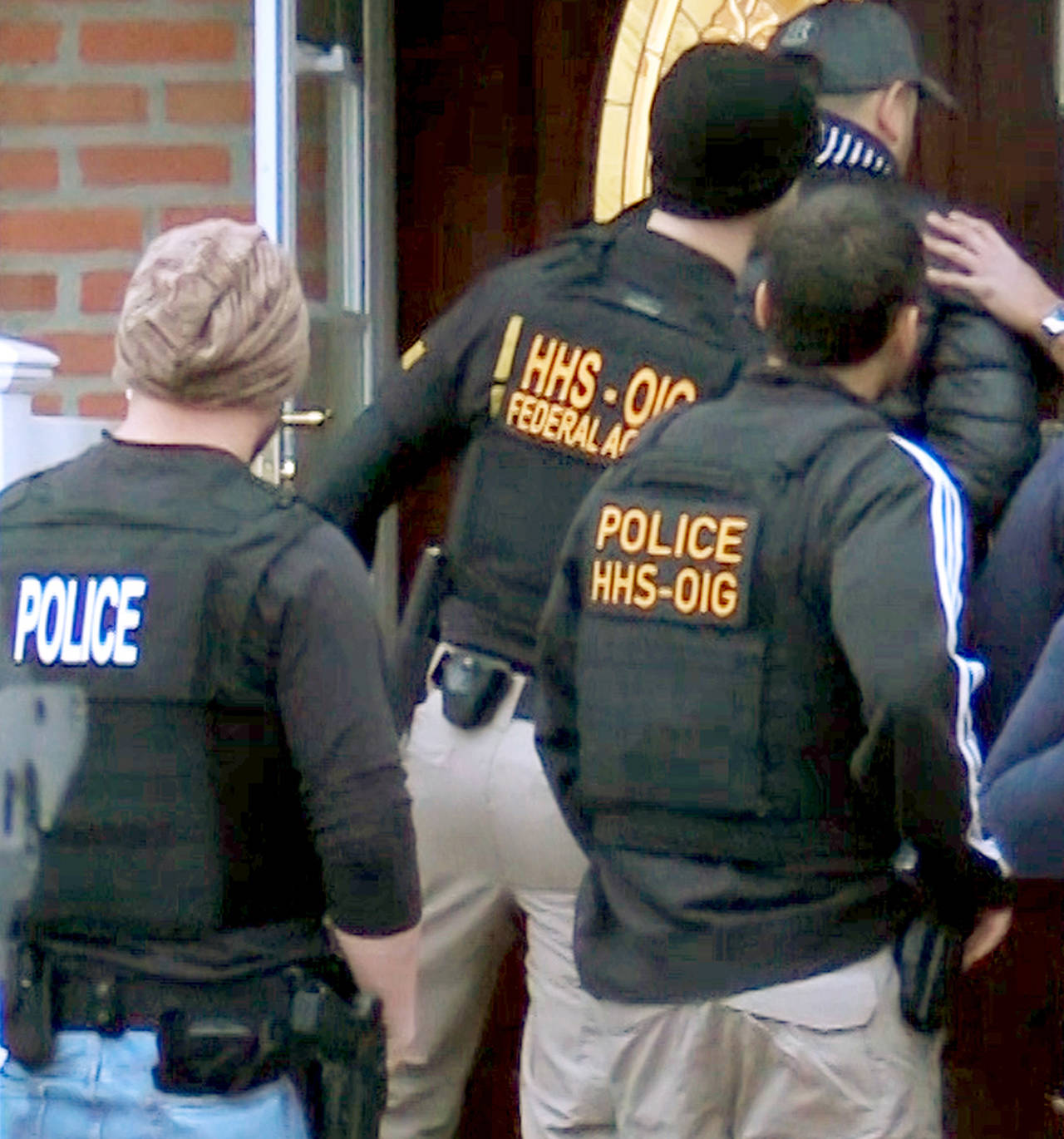 Office of Inspector General, HHS Office of Inspector General agents and other law enforcement officers take part in arrests Tuesday in Queens, New York, as they break up a billion-dollar Medicare scam that peddled unneeded orthopedic braces to hundreds of thousands of seniors nationwide, using a network of foreign call centers. (Department of Health and Human Services, Office of Inspector General via AP)