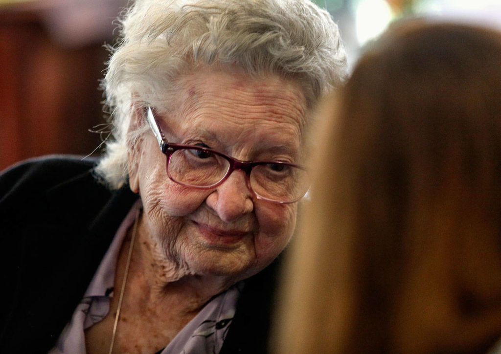 On her 110th birthday Monday, LaVerne Bunney talks with well-wishers, friends and relatives. She is sharp, sees well, but her hearing isn’t what it used to be. (Dan Bates / The Herald)

