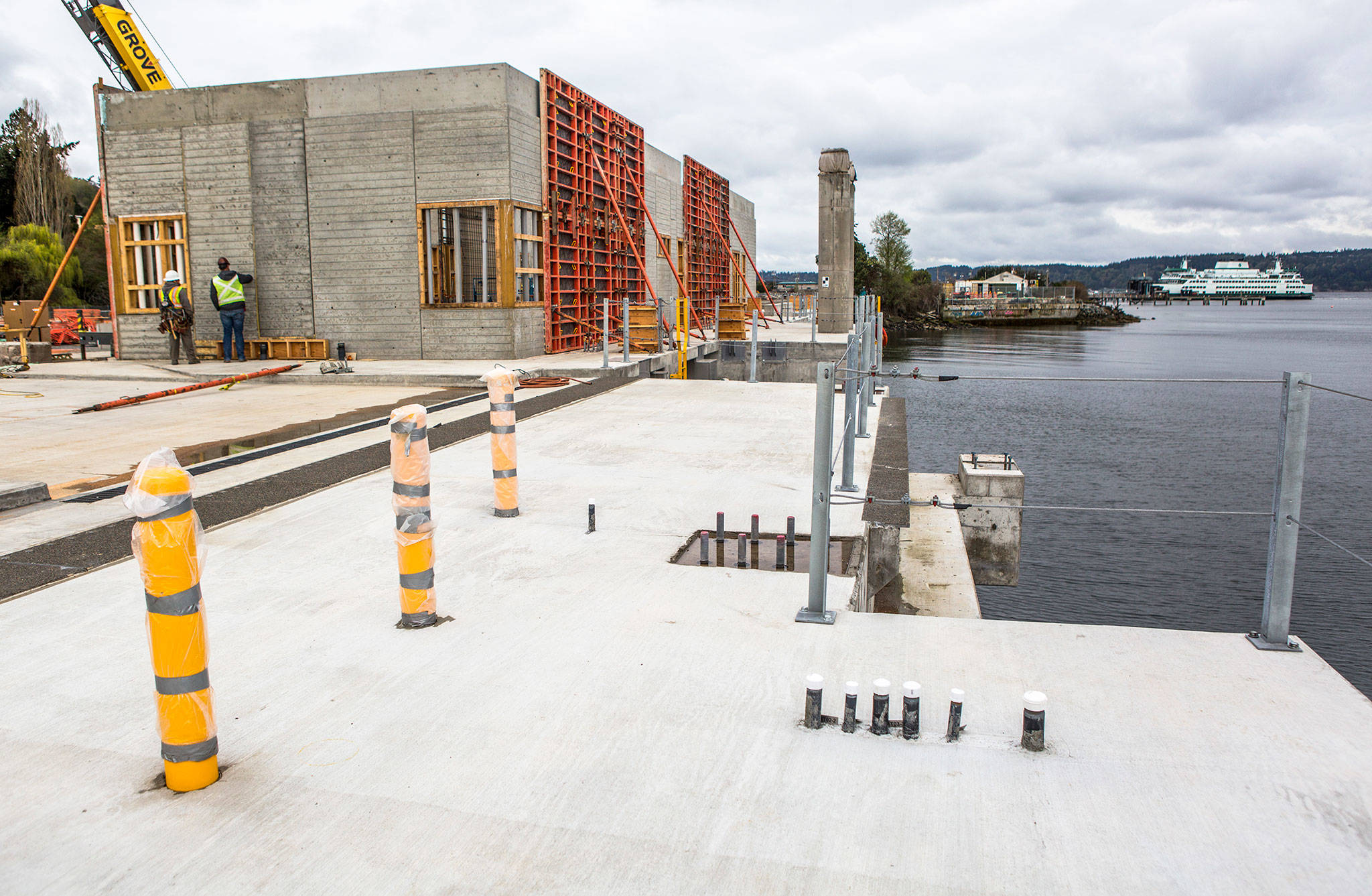 A ferry pulls into the current Mukilteo Ferry Terminal as construction continues on at the site of the new Mukilteo ferry terminal on Wednesday. (Olivia Vanni / The Herald)