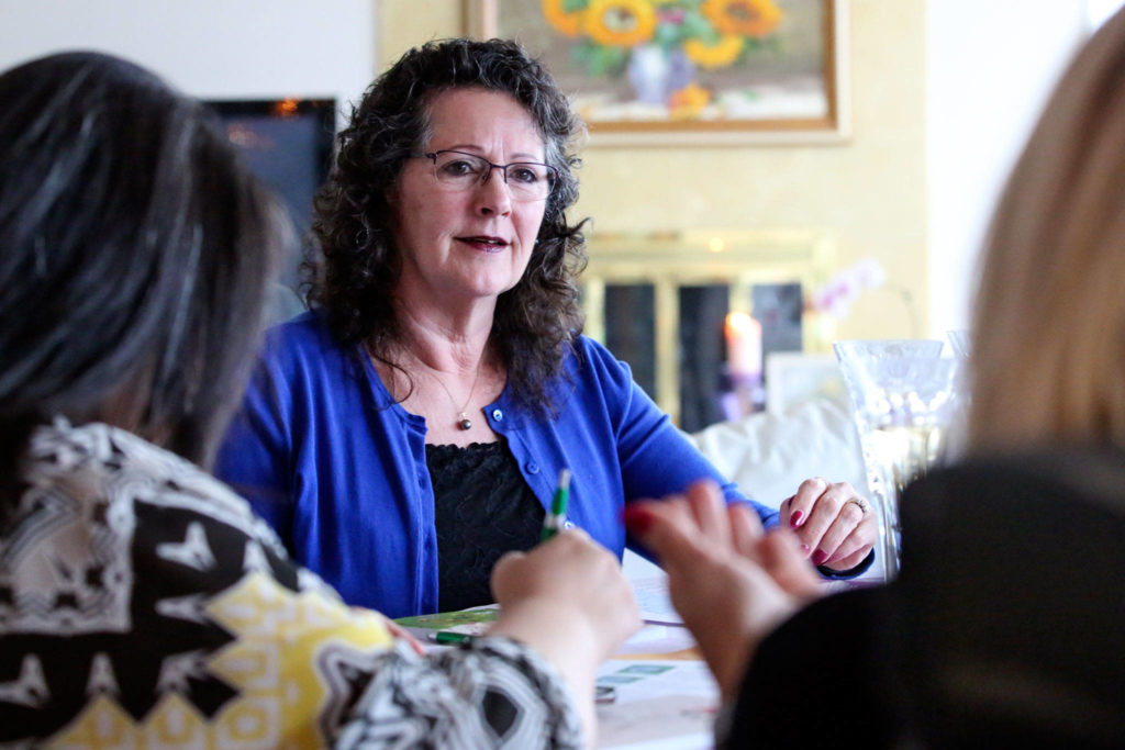 “My $100 doesn’t look like a lot, but if I can get 99 of my friends together and each contribute $100, what a huge impact to a nonprofit in our community,” says 100 Women Who Care chapter member Kim Olafson. (Kevin Clark / The Herald)

