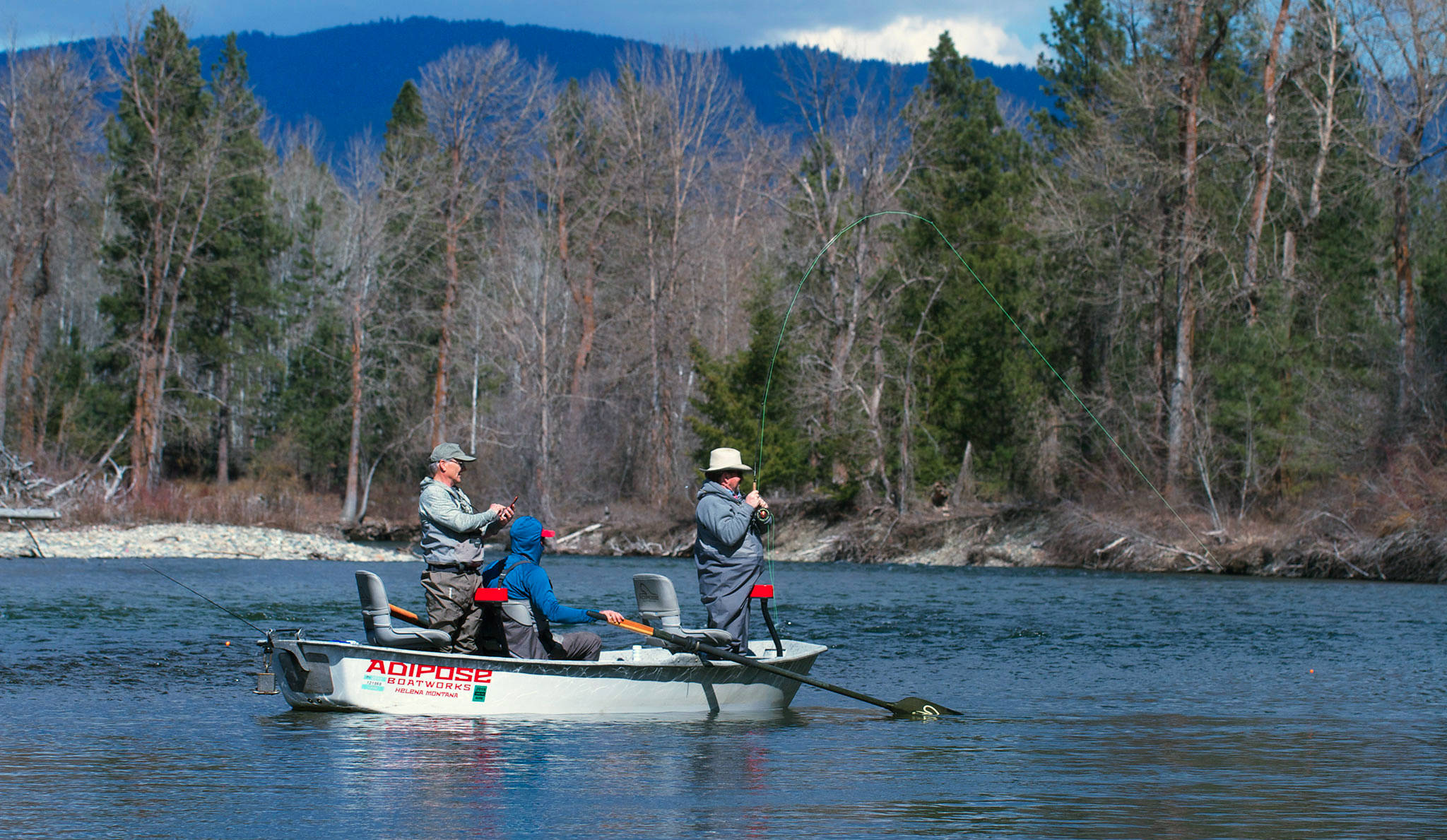 Les Bouck of Everett lands a nice trout on a sunny March day on the upper Yakima River. (Mike Benbow photo)