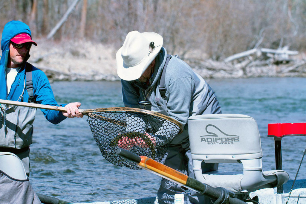 Les Bouck of Everett admires a trout he caught on the Yakima River. (Mike Benbow photo)
