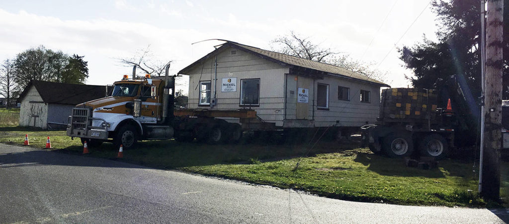 The house formerly at 1328 Eighth St. in Marysville was loaded onto a truck Tuesday evening. It was built in 1901. (Connie Mennie / City of Marysville)
