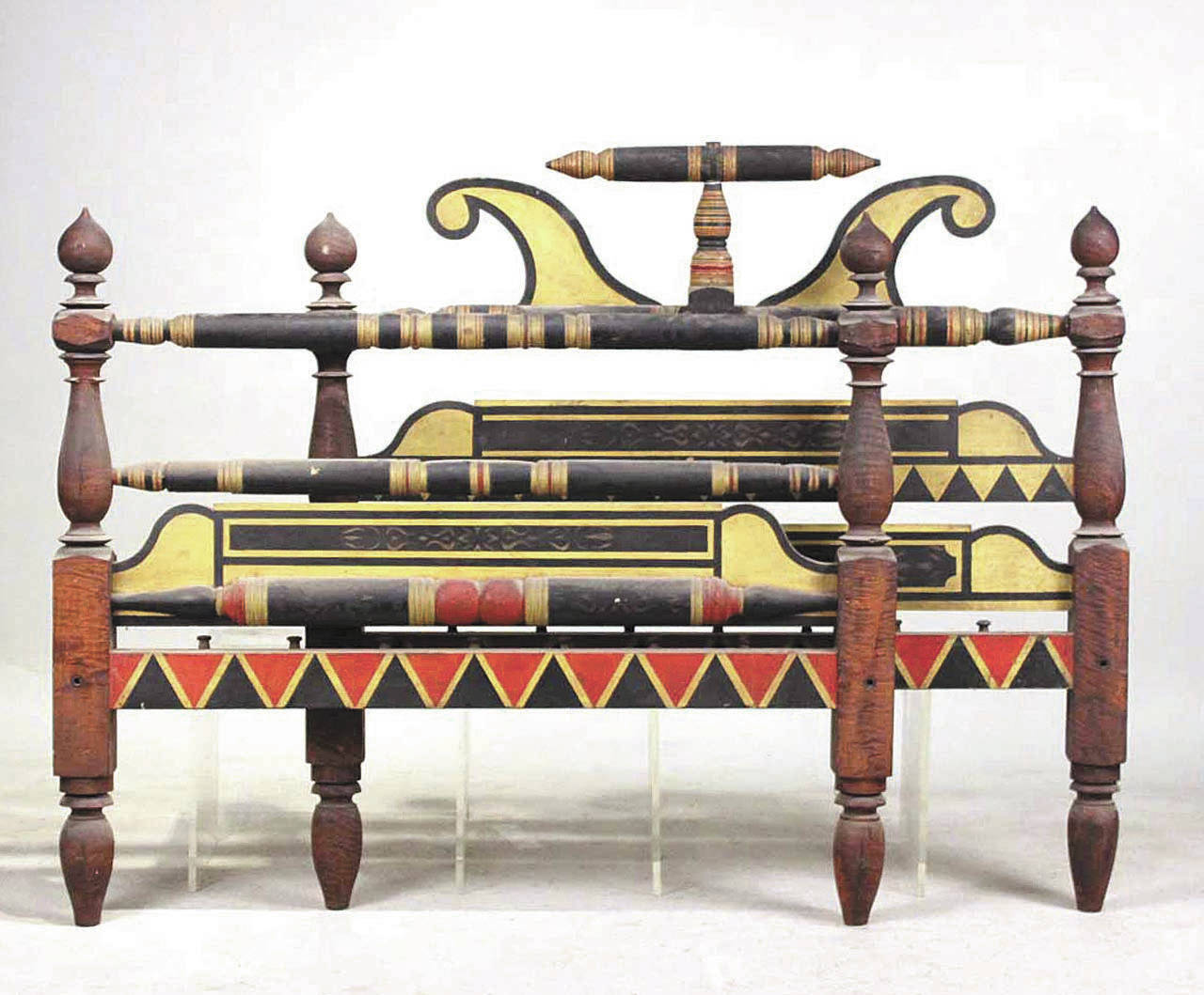 This unusual bed with decorative bright paint sold recently for $12,500. It was made about 1830. There are pegs to use for “sacking” to hold the mattress, not side holes for roping the bed. It can be converted to hold a modern mattress. (Cowles Syndicate Inc.)