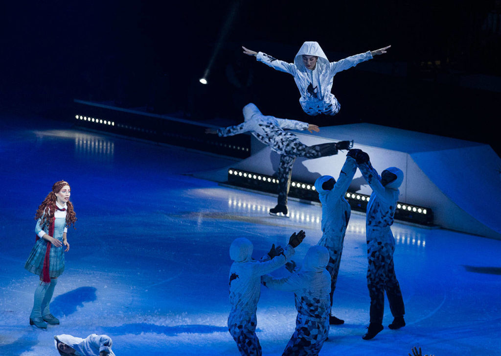 Silja Dos Reis, as Crystal, watches as acrobats fly through the air and skate around her. (Andy Bronson / The Herald)
