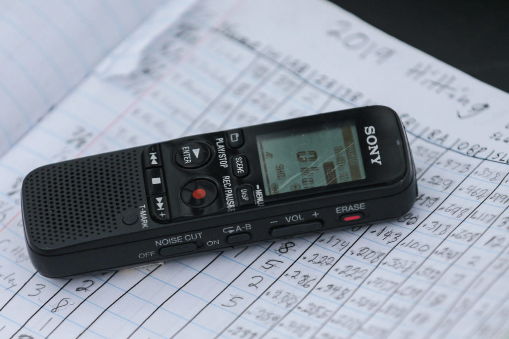 Payne Patchett uses a recorder and a detailed collection of stats and notes. (Kevin Clark / The Herald)
