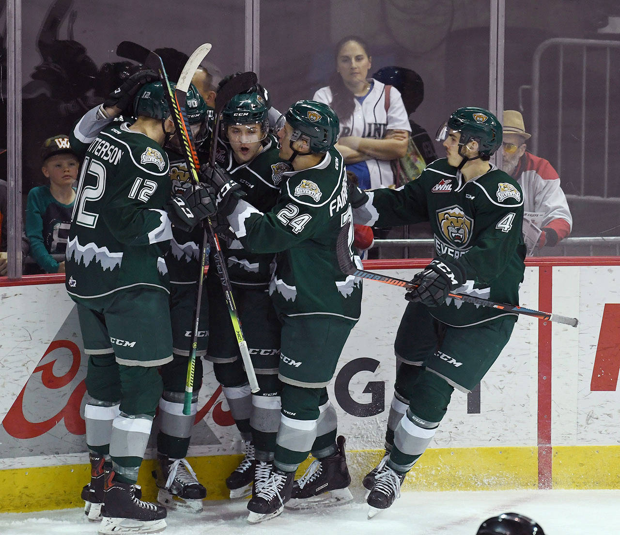 Silvertips players celebrate a goal by forward Robbie Holmes (90) during the first period of a playoff game against the Chiefs on Friday in Spokane. (Colin Mulvany / The Spokesman-Review)