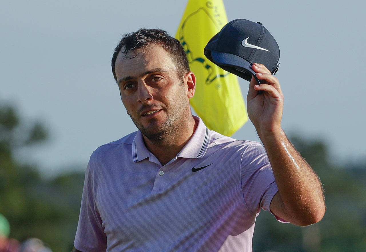 Italy’s Francesco Molinari tips his hat on the 18th green after the third round of the Masters on April 13, 2019, in Augusta, Ga. (AP Photo/Chris Carlson)