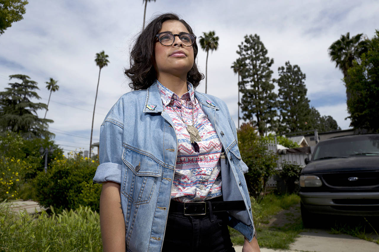 In this April 8 photo, Naia Al-Anbar stands on a street in the Glendale section of Los Angeles. “The truth is we aren’t ever going to be white in their eyes and we will still be discriminated against,” said Al-Anbar, who has a Saudi Arabian father. (AP Photo/Richard Vogel)