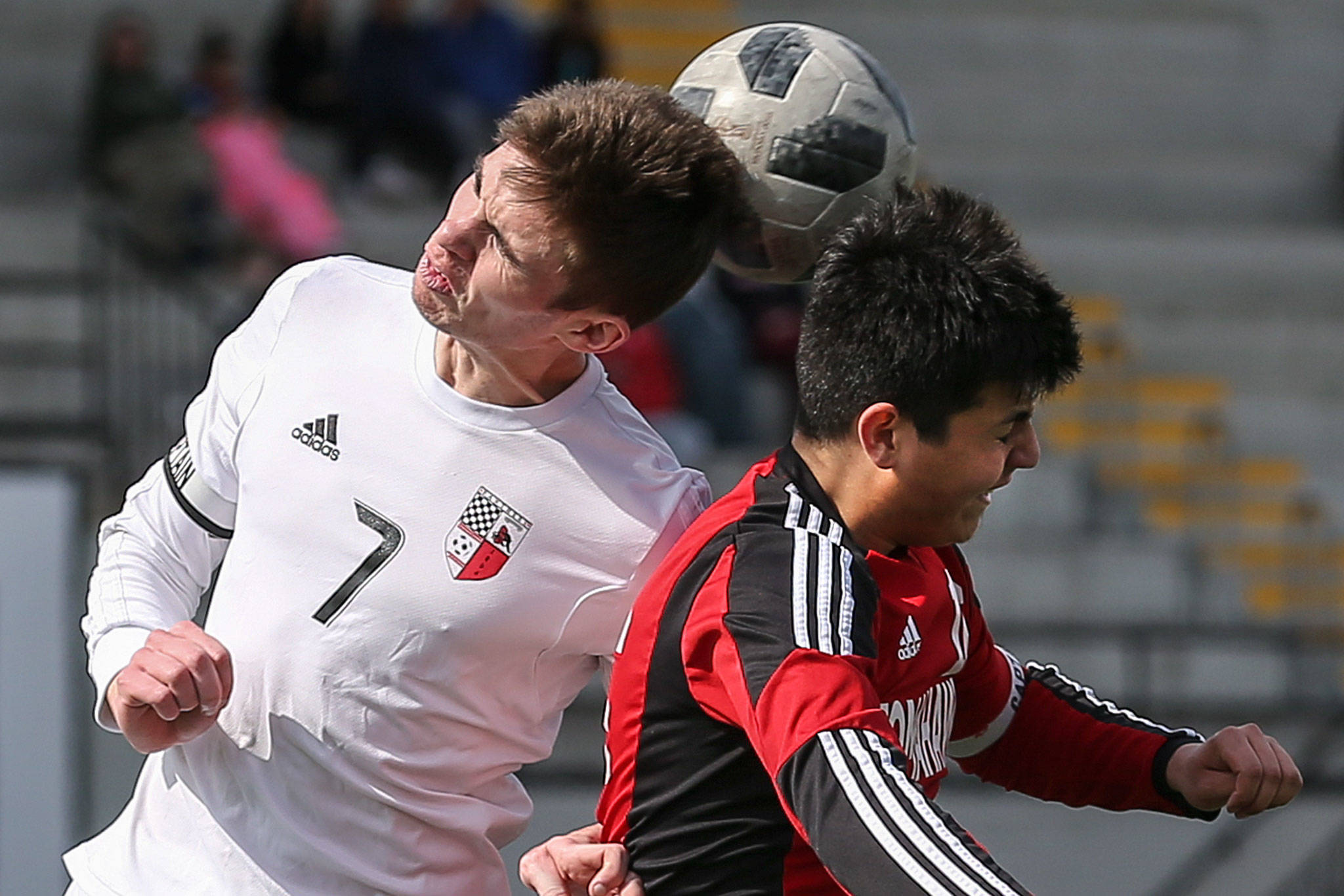Marysville Pilchuck’s Randy Galvan (right) and Snohomish’s Adam Kowalchyk jump for a header during a 1-1 draw on March 23. The Tomahawks sit atop a crowded race in the Wesco 3A/2A boys soccer standings. (Kevin Clark / The Herald)