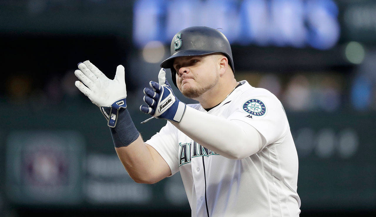 Seattles Daniel Vogelbach claps after hitting a single during Saturdays game against Houston in Seattle. (AP Photo/Elaine Thompson)