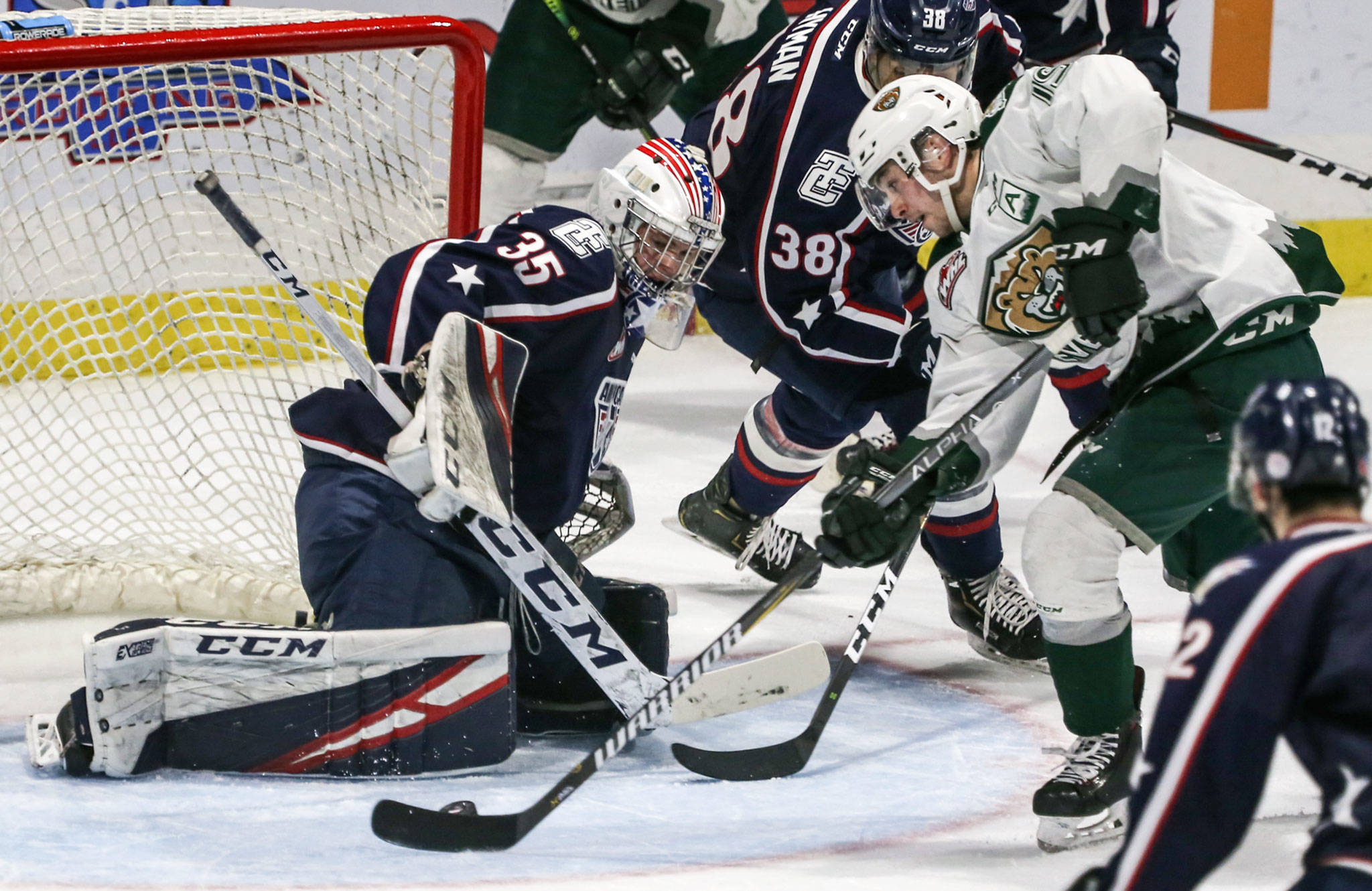Everett’s Bryce Kindopp scores a goal past Tri-City’s Beck Warm during the first period of Game 5 of the Silvertips’ first-round playoff series against the Americans on March 30 at Angel of the Winds Arena in Everett. (Kevin Clark / The Herald)