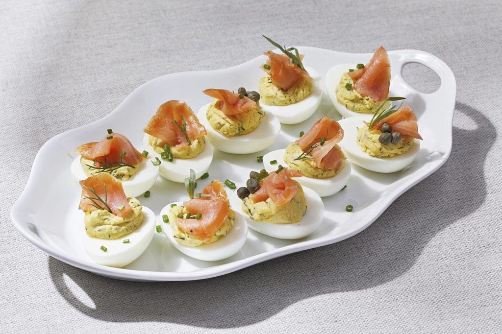 Use cold-smoked salmon as a garnish for deviled eggs for a guaranteed hit on Easter. (Photo by Tom McCorkle for The Washington Post)
