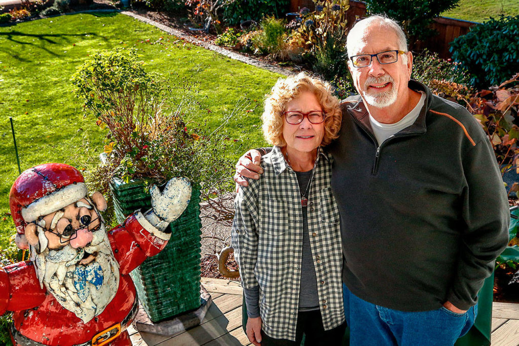 Gerry and Bonnie Gibson in their back yard on the Skykomish River in Sultan in 2018. (Dan Bates / Herald file)
