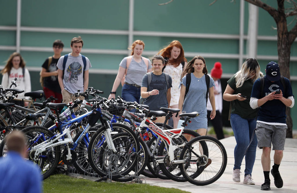 Students leave Columbine High School late Tuesday in Littleton, Colorado. (AP Photo/David Zalubowski)
