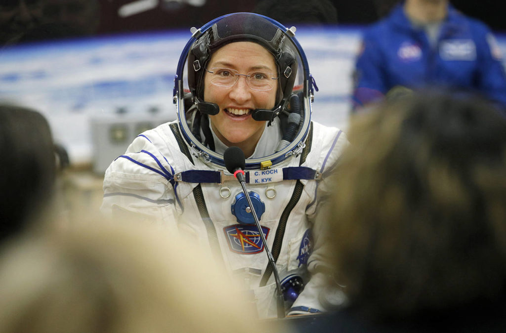 In this March 14 photo, U.S. astronaut Christina Koch, member of the main crew of the expedition to the International Space Station (ISS), speaks with her relatives through a safety glass prior the launch of Soyuz MS-12 space ship at the Russian leased Baikonur cosmodrome, Kazakhstan. (AP Photo/Dmitri Lovetsky, Pool)
