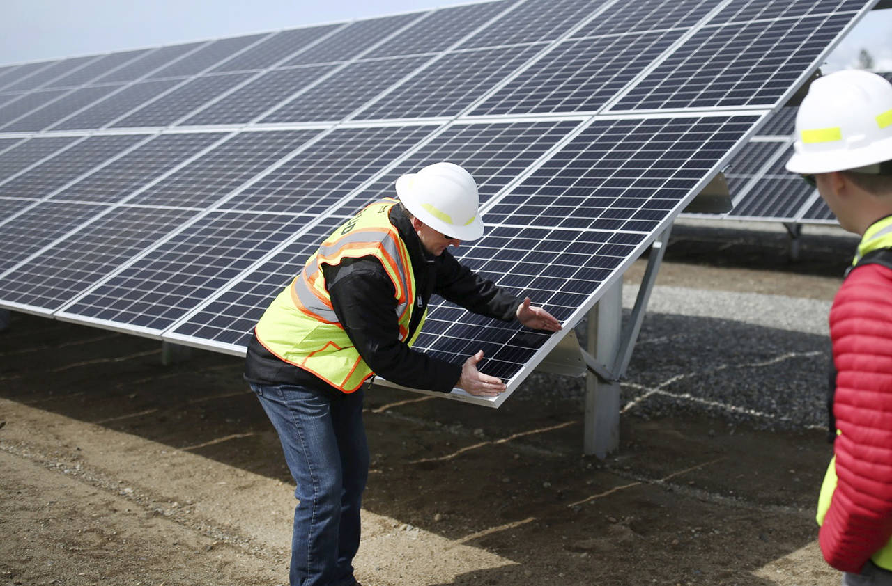 Project manager Scott Gibson demonstrates the approximate size of one unit. (Julia-Grace Sanders/ The Herald)