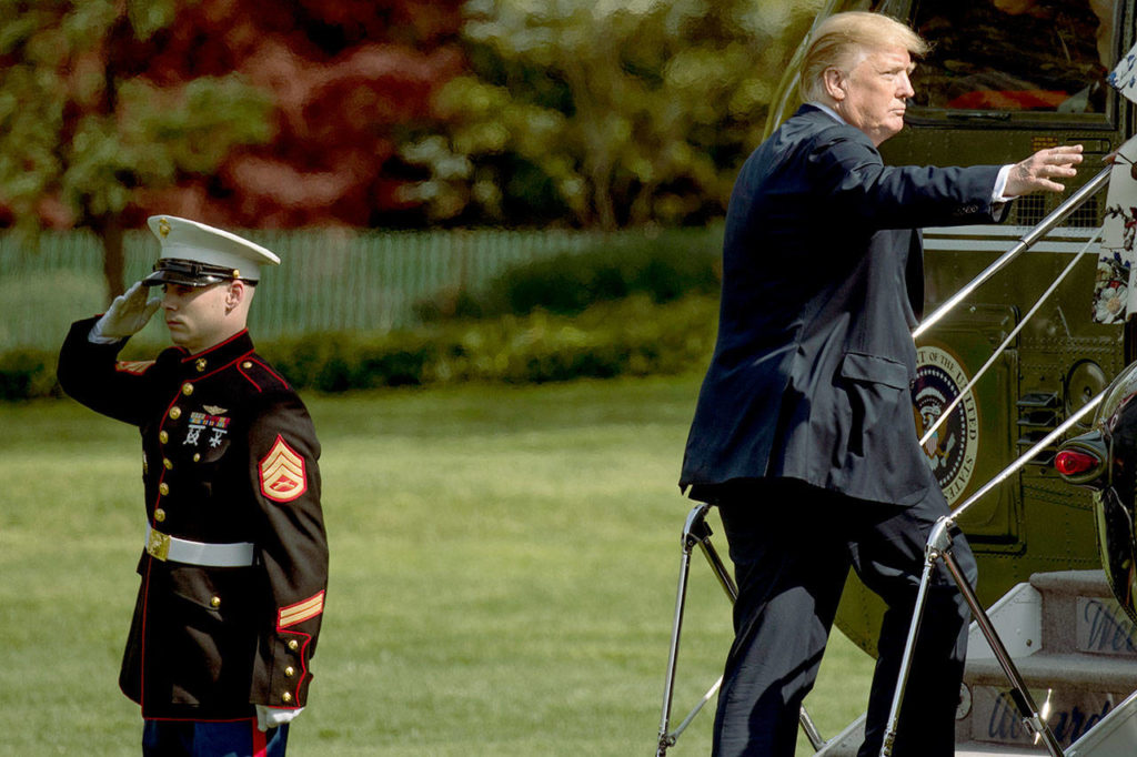 President Donald Trump boards Marine One on the South Lawn of the White House on Thursday for a short trip to Andrews Air Force Base, Maryland. (AP Photo/Andrew Harnik) 
