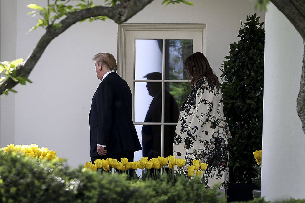 President Donald Trump, seen Thursday with the first lady, tweeted after the release of the report that it was a “great day for America!”(Oliver Contreras / The Washington Post)