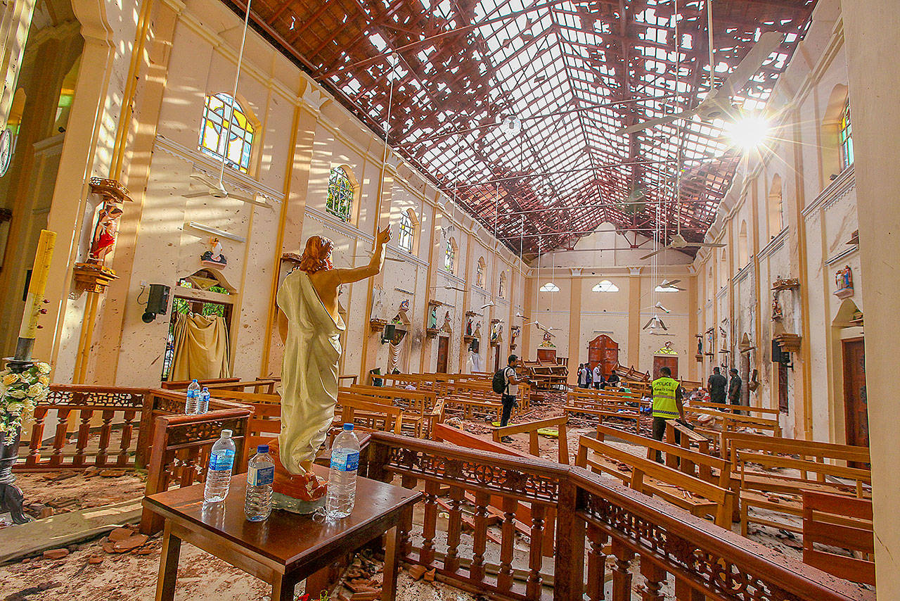 A view of St. Sebastian’s Church damaged in a blast Sunday in Negombo, north of Colombo, Sri Lanka. At least 290 people were killed and hundreds more hospitalized with injuries from nine blasts that rocked churches and hotels in and just outside of Sri Lanka’s capital on Easter Sunday, officials said. (AP Photo/Chamila Karunarathne)