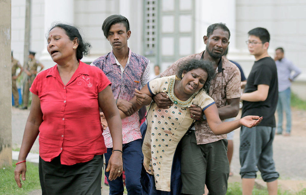 Relatives of a blast victim grieve Sunday outside a morgue in Colombo, Sri Lanka. It is the worst violence to hit the South Asian country since its civil war ended a decade ago. (AP Photo/Eranga Jayawardena)
