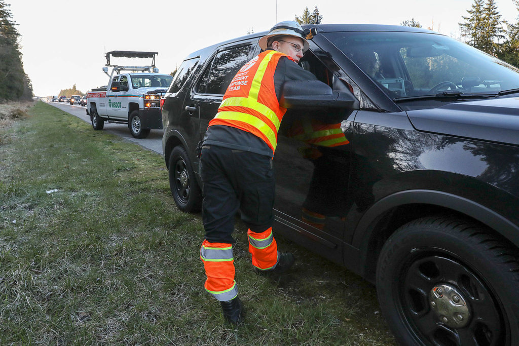 Ken Buretta, who’s from the state’s Incident Response Team, checks in with a trooper after arriving at an incident. (Lizz Giordano / The Herald)
