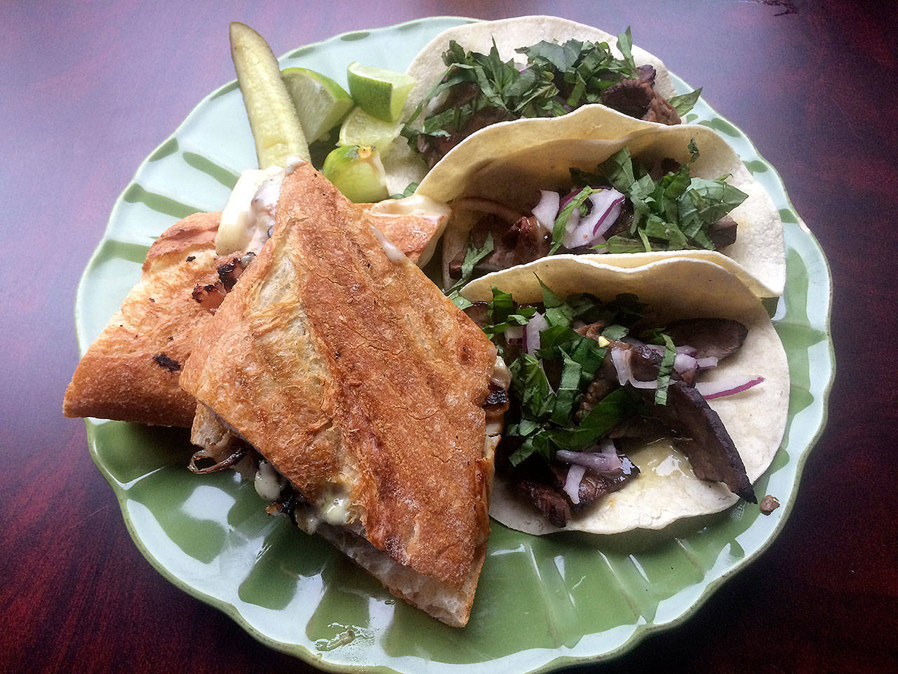 The brie baguette at Salted Grape Cafe includes turkey ham, brie cheese and pesto aioli, while the Asian steak tacos come with soy marinated flank steak, basil, red onion and sweet wasabi aioli. (Evan Thompson / The Herald)