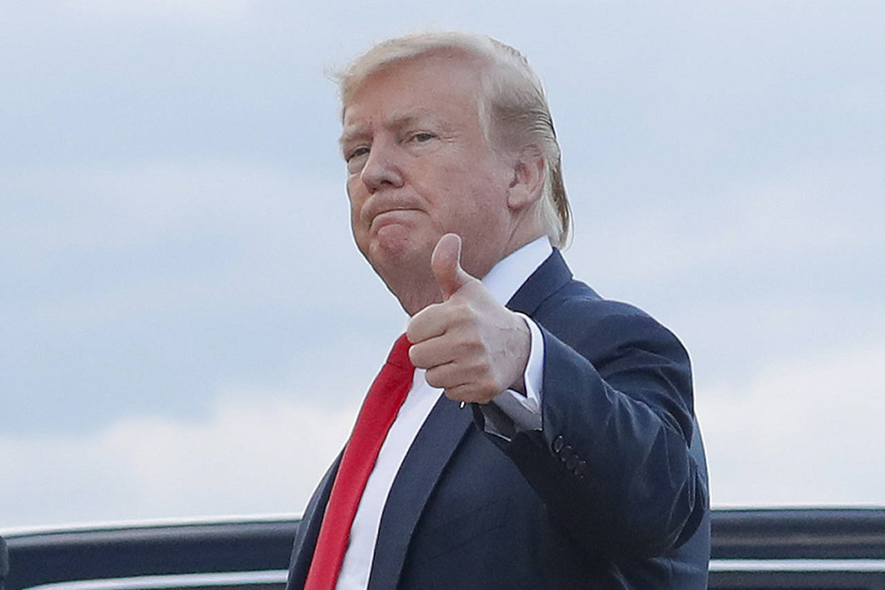 President Donald Trump gives a ‘thumbs-up’ as he walks across the tarmac Sunday during his arrival on Air Force One at Andrews Air Force Base. (AP Photo/Pablo Martinez Monsivais)
