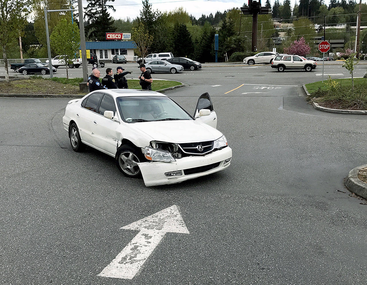 Police pursued a homicide suspect Tuesday afternoon in a chase from Everett on southbound I-5 that ended in a WinCo parking lot in the 21900 block of Highway 99 in Edmonds. Two men were arrested. (Chuck Taylor / The Herald)