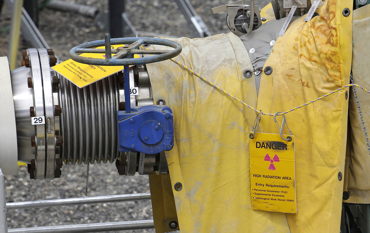In this 2014 photo, a sign warns of high levels of radiation near a valve at the “C” tank farm during a media tour of the Hanford Nuclear Reservation near Richland. (AP Photo/Ted S. Warren, File)