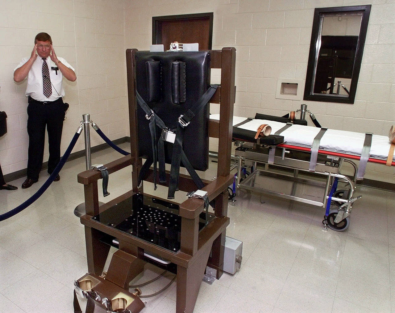 In this 1999 photo, Ricky Bell, the warden at Riverbend Maximum Security Institution in Nashville, Tennessee, gives a tour of the prison’s execution chamber. (AP Photo/Mark Humphrey, File)
