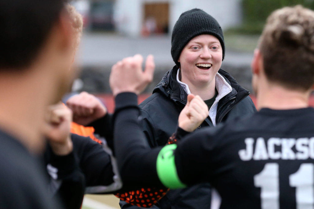 Sarah Smart, first year boys varsity head coach, greets her team as they are announced against Cascade Friday night at Everett Memorial Stadium in Everett on April 26, 2019. (Kevin Clark / The Herald)
