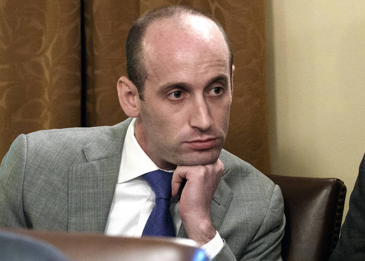 In this 2018 photo, White House senior adviser Stephen Miller listens as President Donald Trump speaks during a cabinet meeting at the White House in Washington. (AP Photo/Evan Vucci, File)