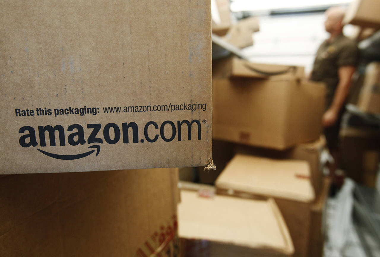 Amazon, which hooked shoppers on getting just about anything delivered in two days, announced Thursday that it will soon promise one-day delivery for its Prime members on most items. (AP Photo/Paul Sakuma, File)
