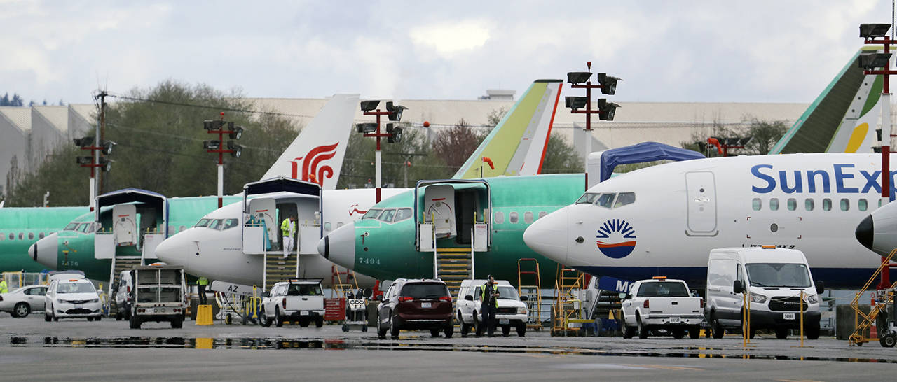 In this April 8 photo, Boeing 737 Max model aircraft are parked at the airport adjacent to a Boeing Co. production facility in Renton. (AP Photo/Elaine Thompson, File)