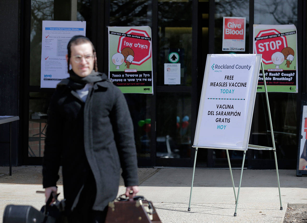 Signs about measles and the measles vaccine are displayed at the Rockland County Health Department in Pomona, New York, on March 27. Measles continues to spread in the United States, with more 704 cases reported so far this year spread among 22 states. U.S. health officials Monday updated the national tally, which already has eclipsed the total for any full year since 1994, when 963 cases were reported. (AP Photo/Seth Wenig, File)