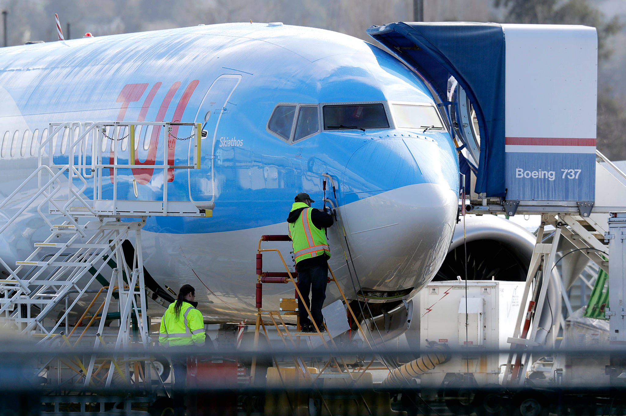A worker checks sensors on a Boeing 737 MAX 8 airplane being built for TUI Group at the Boeing Co.’s Renton assembly plant March 13. (AP Photo/Ted S. Warren)