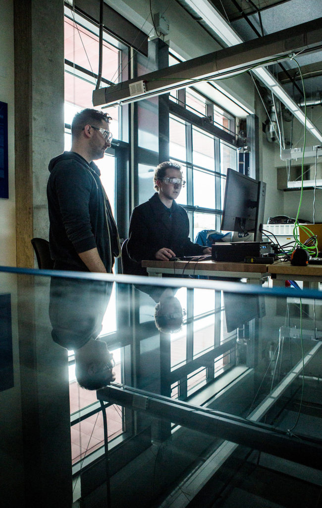 Austin Stowe, left, and Isaac Hall work on a laser-cutter template for pieces of a box at TheLab@everett. (Olivia Vanni / The Herald)
