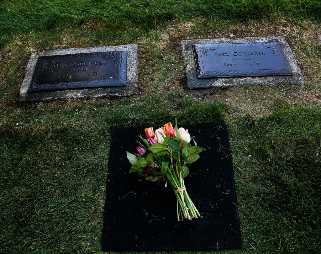 Flowers placed by a family member decorate the grave of Daniel Guisinger Jr., an Everett sailor killed at Pearl Harbor. He was buried April 27 between his parents, Daniel Sr. and Inez Guisinger, at Cypress Lawn Memorial Park. (Dan Bates / The Herald)
