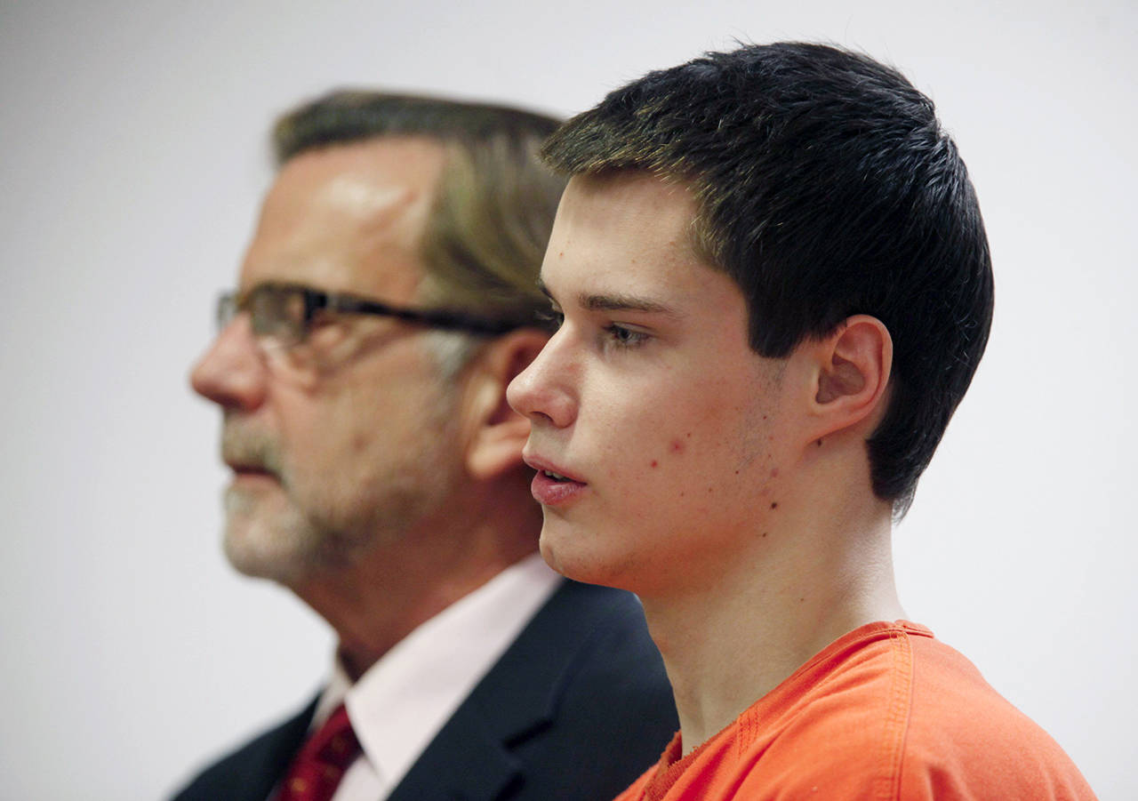 Colton Harris-Moore stands in front of Judge Vickie I. Churchill in Island County Superior Court to enter guilty pleas to 15 charges and an Alford Plea to one firearms charge in Coupeville on Dec. 16, 2011. (Mark Mulligan / Herald file)