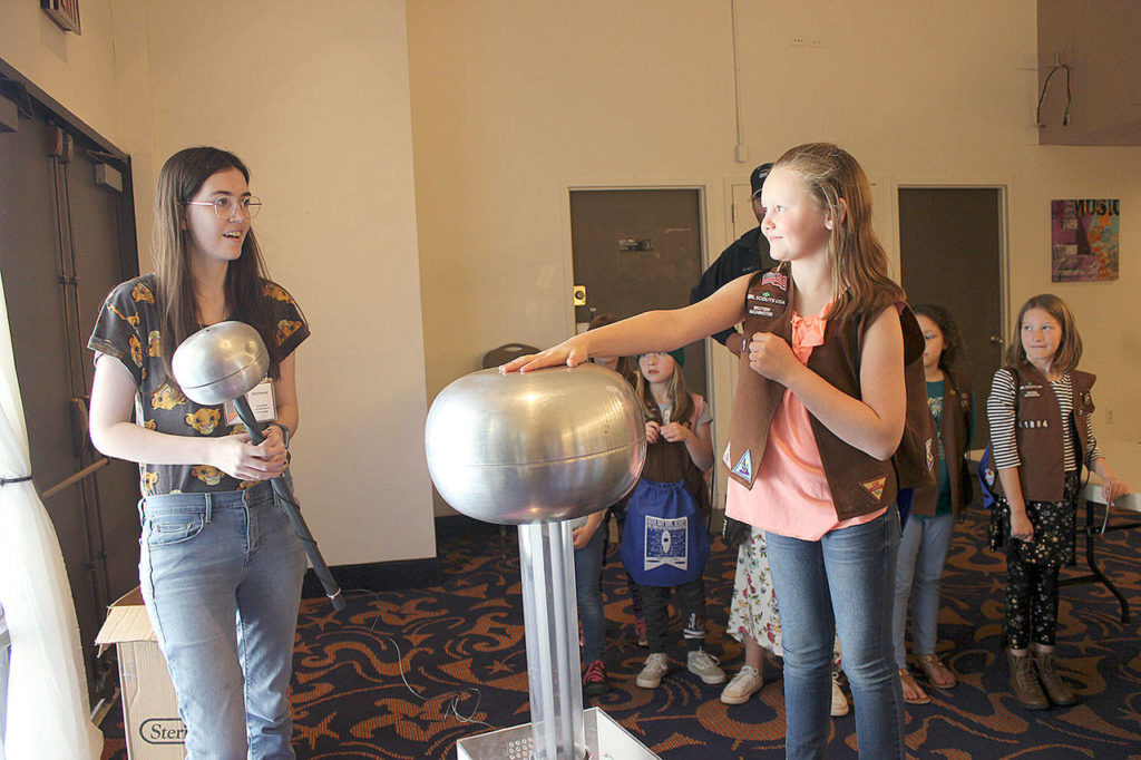 Cozette Vallerie (right) experiments with a Van De Graff provided by Imagine Children’s Museum. (Submitted photo)

