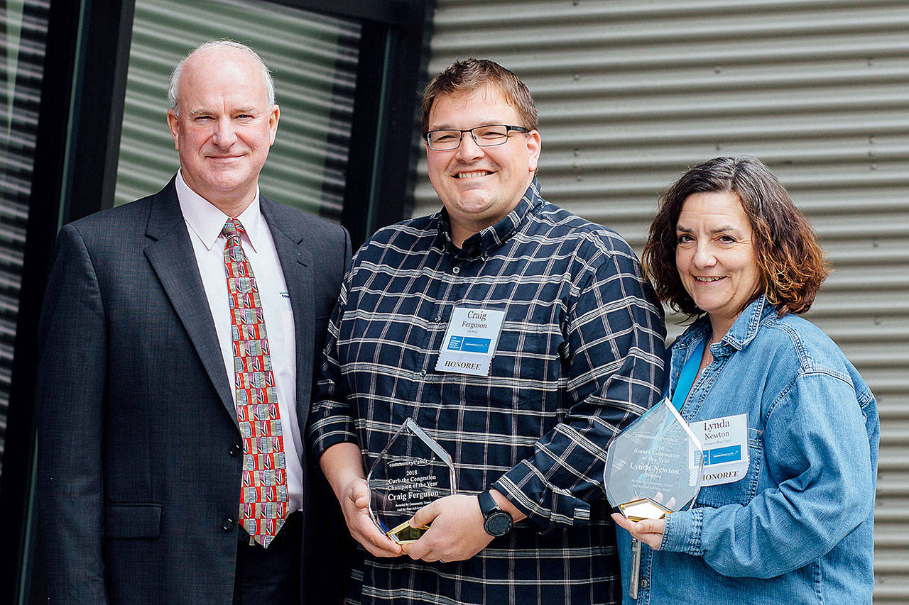 Emmett Heath, Community Transit CEO (left), Craig Ferguson (center) and Lynda Newton (right). Ferguson and Newton were named 2019 Commuter Champions by the transit agency. (Community Transit)