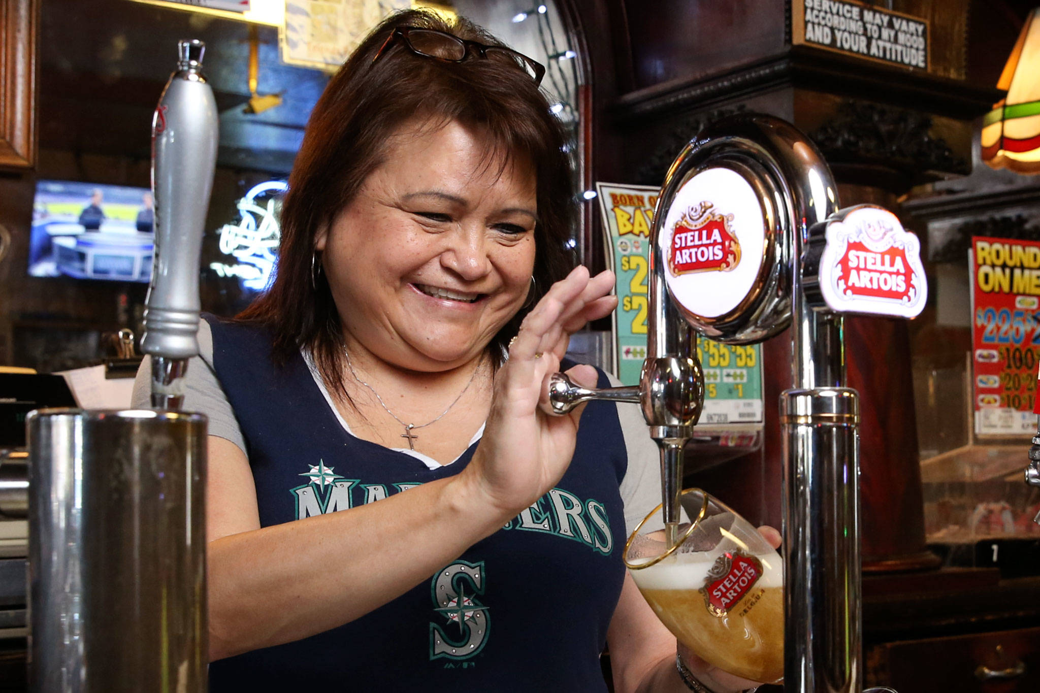 Denise McKenzie, 12-year bartender, pours a beer at Kuhnle’s Tavern in Marysville. (Kevin Clark / The Herald)
