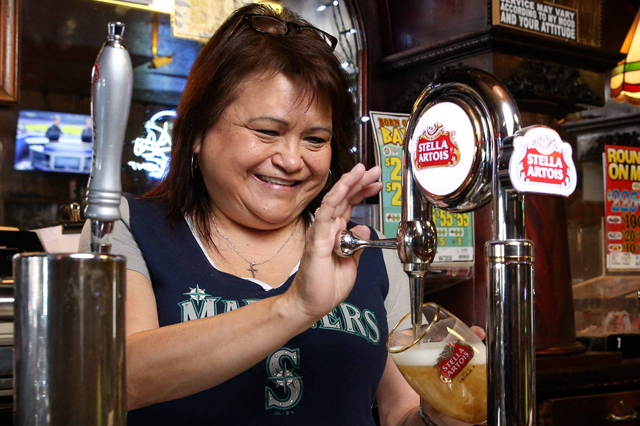 Kuhnle’s Tavern bartender pours them as she sees them