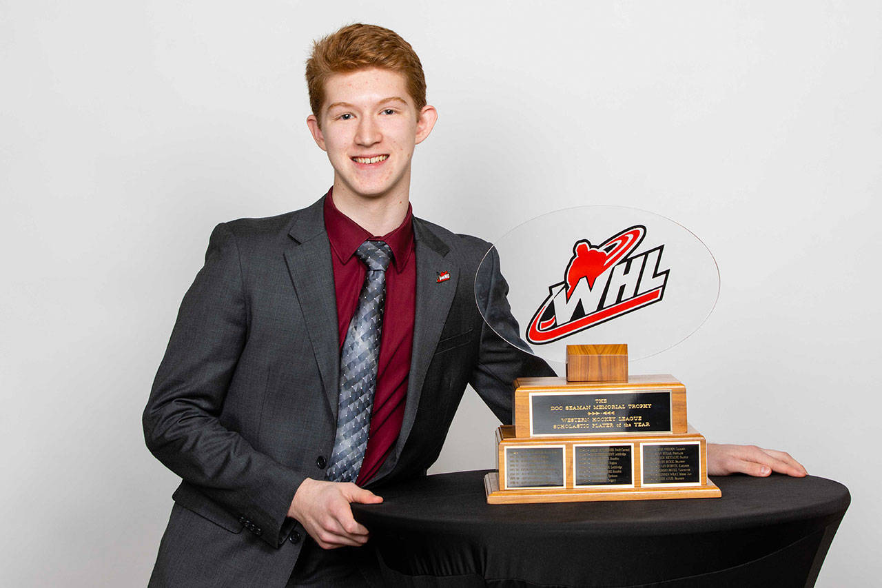 Silvertips goaltender Dustin Wolf poses with the Doc Seaman trophy after being named the WHL’s scholastic player of the year at ceremony on May 1, 2019, in Red Deer, Alberta, Canada. (WHL photo)