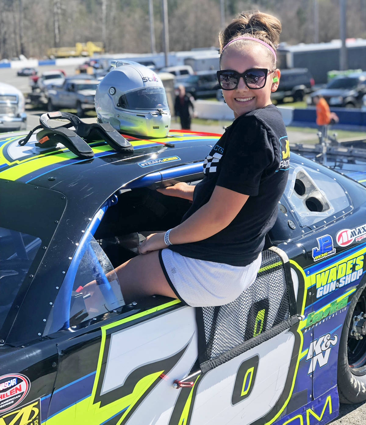 Haley Constance climbs in the NASCAR Super Late Models car driven by her dad, Joe Constance, as she helps get it ready for a race. Still just 13, she’s been making a name for herself in the Pacific Northwest junior racing circuits in recent years.