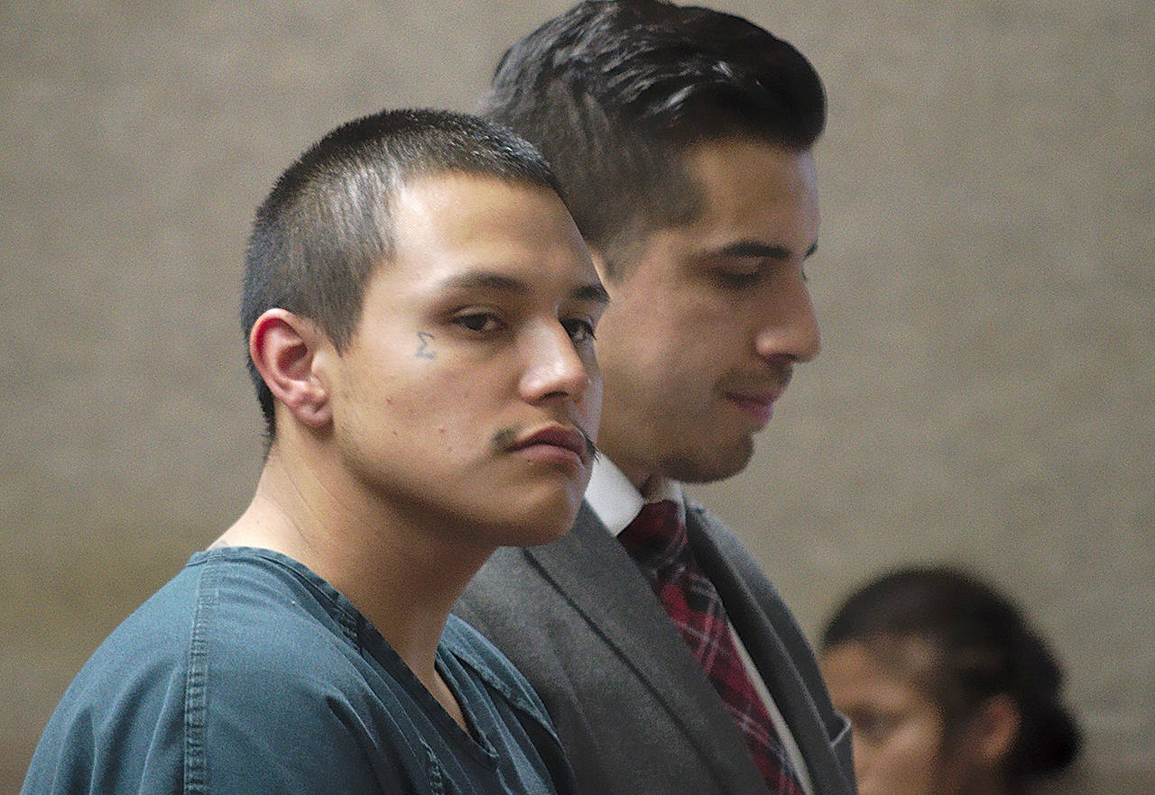 Hector Garcia-Ceja Jr. (left), 24, of Everett, stands next to defense attorney Andres Munoz in Yakima County Superior Court on April 24. (Donald W. Meyers, Yakima Herald-Republic)