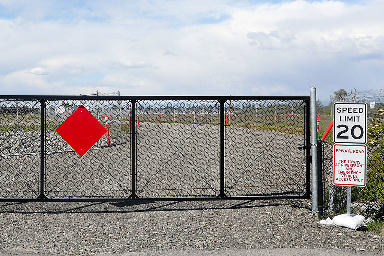 Riverfront Boulevard will eventually replace the gravel road, which is currently only open only to emergency vehicles. It is set to open to residents of the Riverfront townhomes very soon, according to the developer of the land the road runs through. (Lizz Giordano / The Herald)