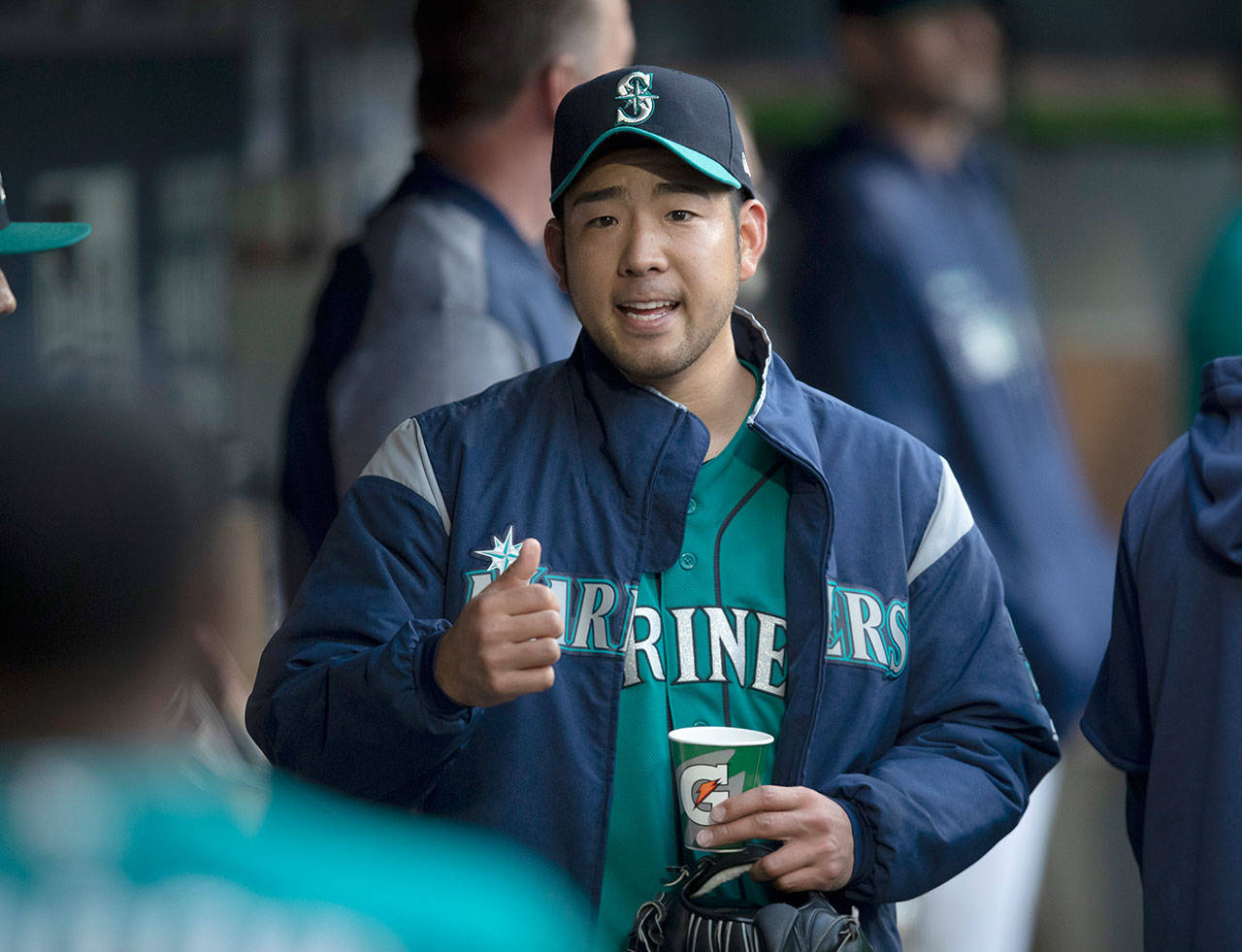 Seattle’s Yusei Kikuchi walks through the dugout during an April 26 game against Texas in Seattle. Kikuchi has been picking the brain of Cleveland star Trevor Bauer. (AP Photo/Stephen Brashear)