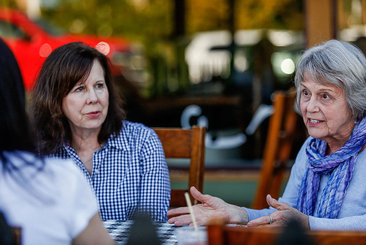 Gretchen Saari (right) and Debbie Warfield talk about a new Snohomish chapter of GRASP — Grief Recovery After Substance Passing. With them is Cathi Lee. All three Everett women lost sons to overdoses. (Dan Bates / The Herald)